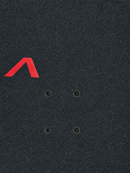 Close-up of premium perforated black grip tape with the custom die-cut Asinine "A" logo and skateboard truck mounting holes.